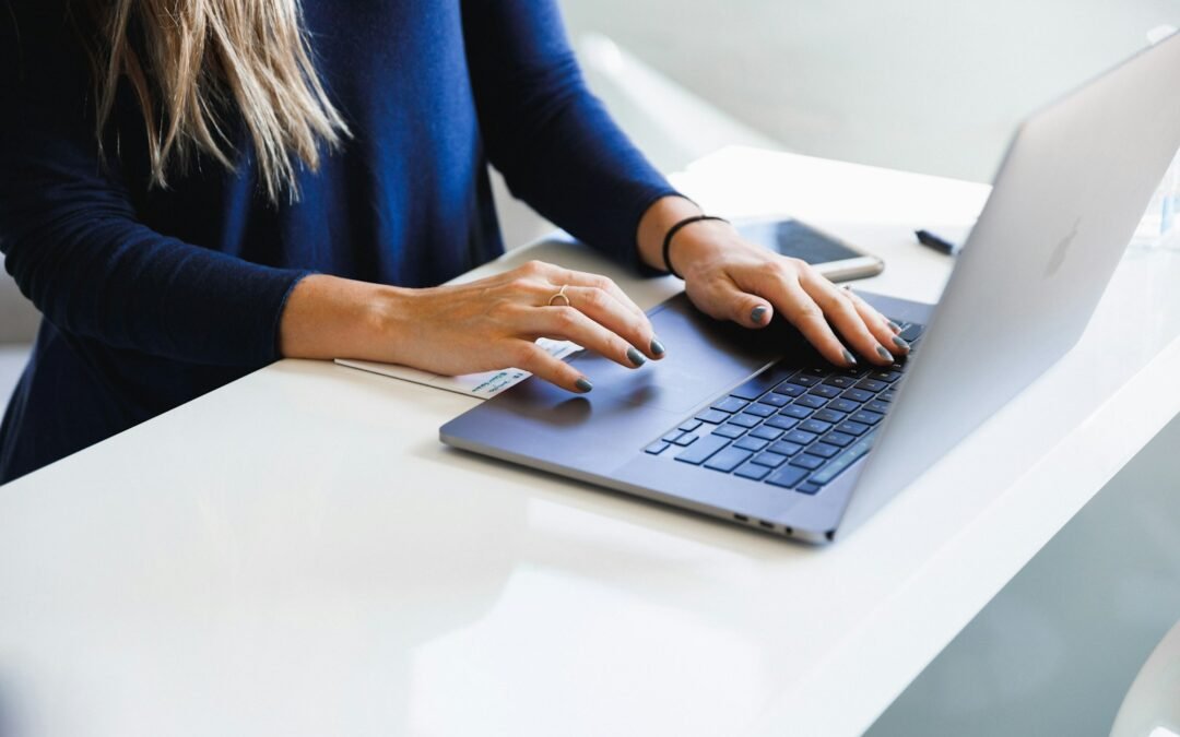 Real estate agent working on a laptop